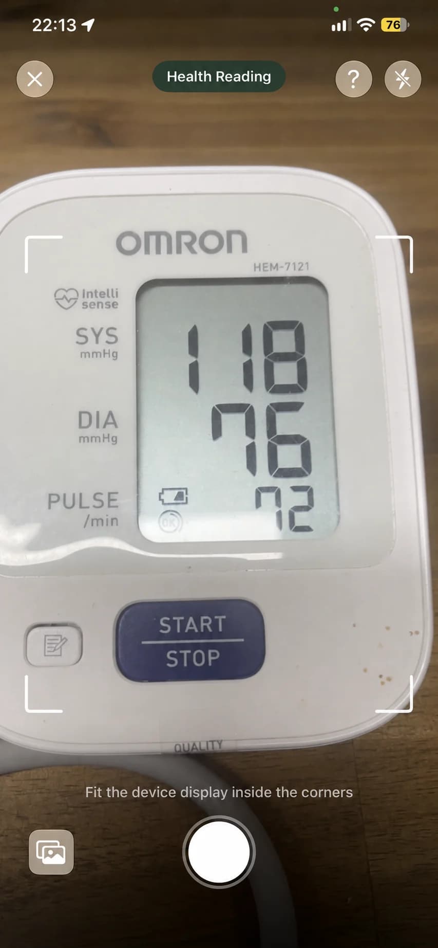 An anonymized Holty camera screen framing a blood pressure monitor with sample values